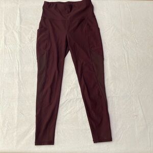 Dark plum leggings with side pockets in good condition